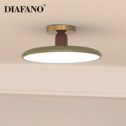 Olive green ceramic led ceiling light with brass-finished mounting ring and dark brown stem for living room use