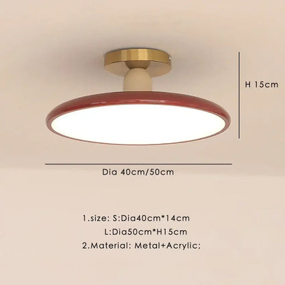 Modern matte white and brass led ceiling light with red-rimmed circular design and acrylic diffuser for living room
