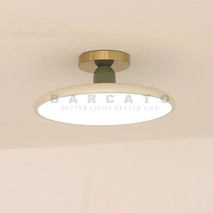 Modern matte white and brass led ceiling light with olive green stem and matte diffuser for living room ceiling light