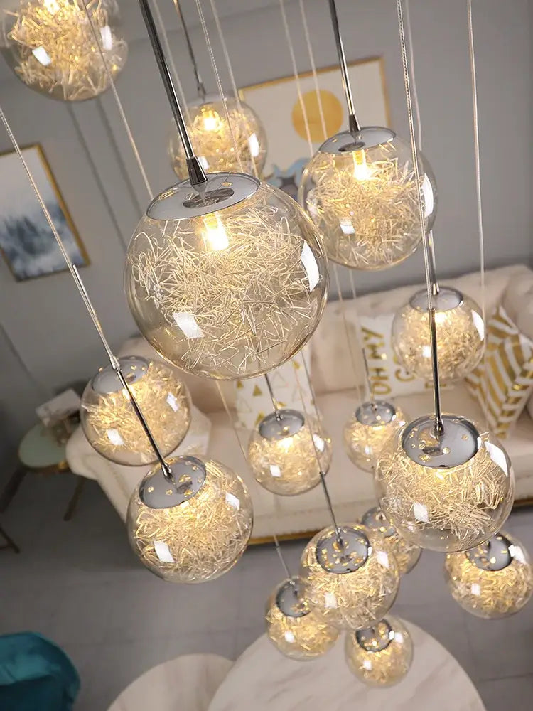 Modern mesh crystal ceiling chandelier featuring clear glass globes with golden filament lights and chrome fixtures decorbites crystal ceiling