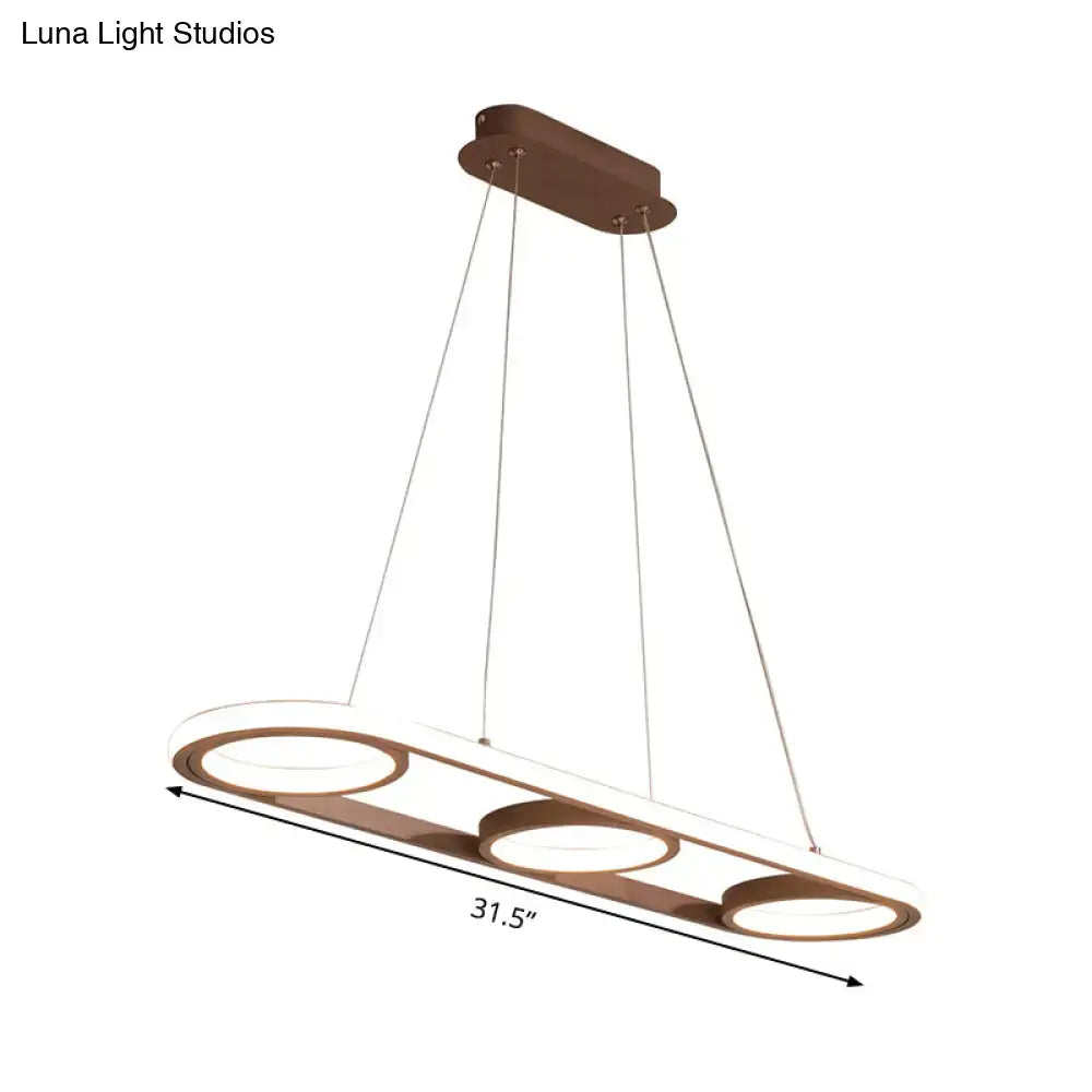 Modern metal bronze-finished pendant light with three circular led rings for kitchen island illumination