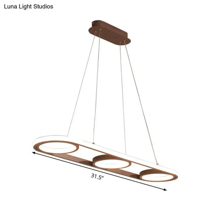 Modern metal bronze-finished pendant light with three circular led rings for kitchen island illumination