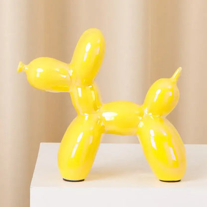 Vibrant yellow modern metallic ceramic balloon dog statue with glossy finish and black rubber feet for living room decorbites ceramic balloon dog decor