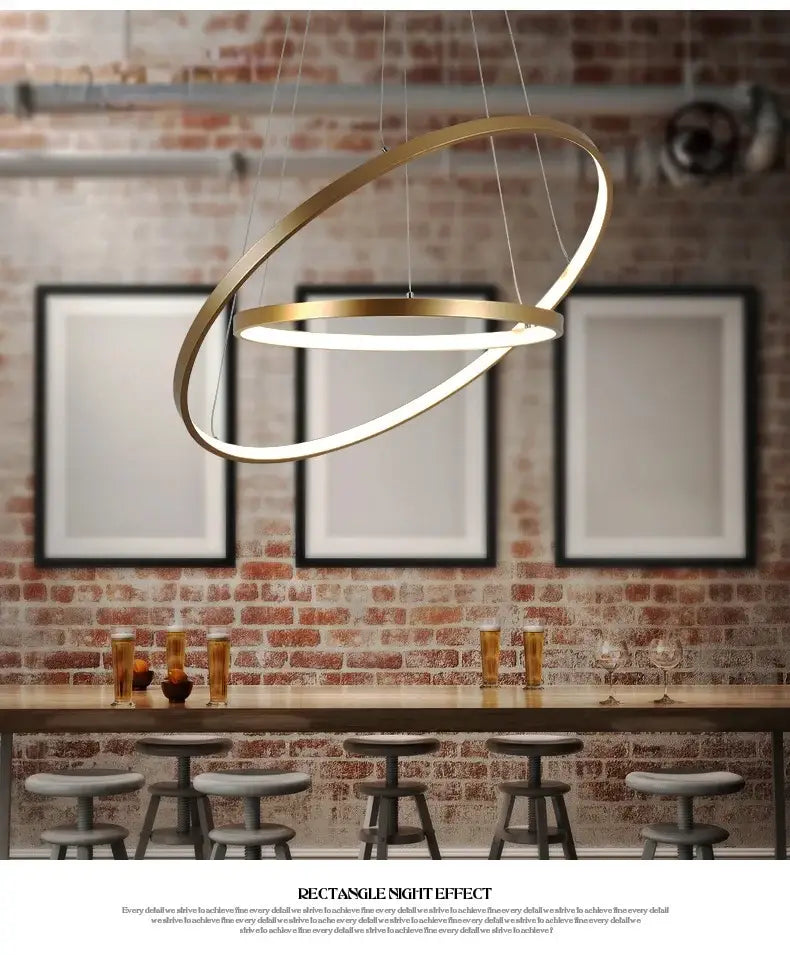 Modern gold-toned pendant lamp featuring metallic circle rings led design for elegant dining room decorbites circle rings