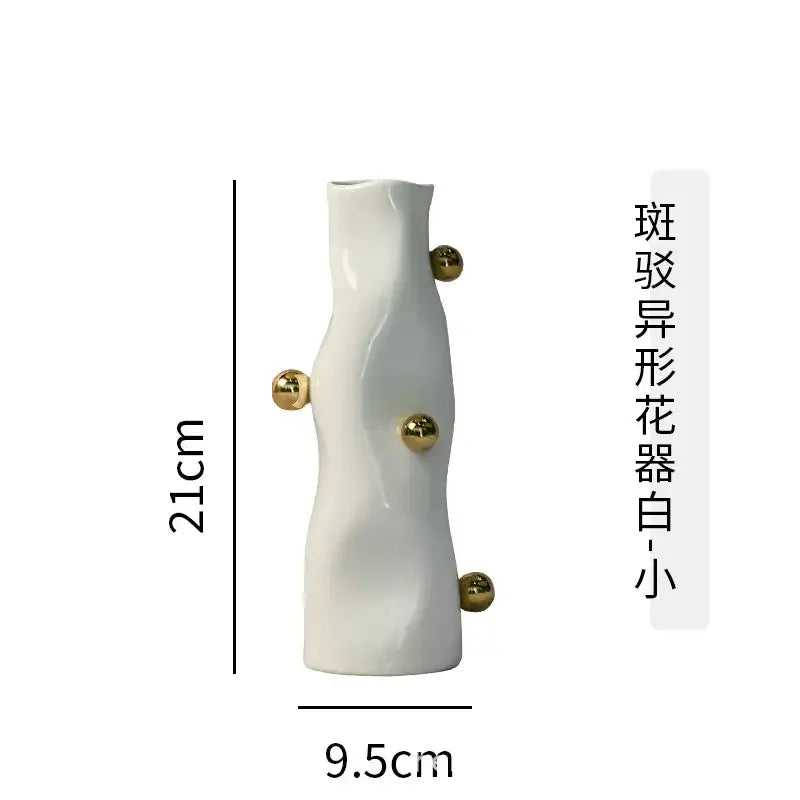A sleek white ceramic decorbites geometric sphere vase with four polished gold spherical accents for modern living rooms
