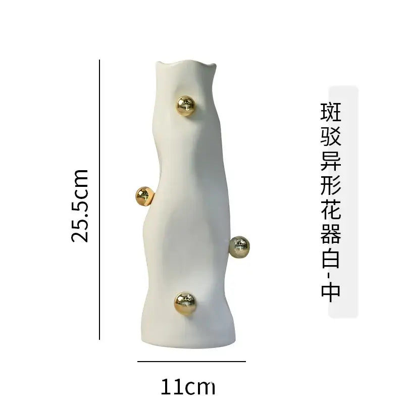 A sleek white ceramic geometric sphere vase with four polished gold accents from decorbites geometric sphere set