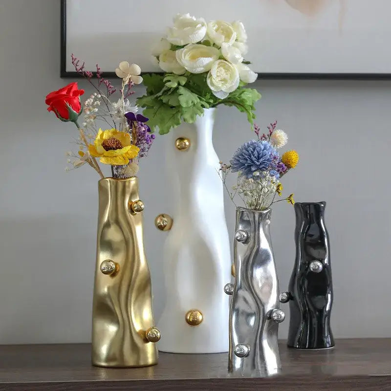 Set of four modern ceramic decorbites geometric sphere vases in gold white silver and black with metallic knobs