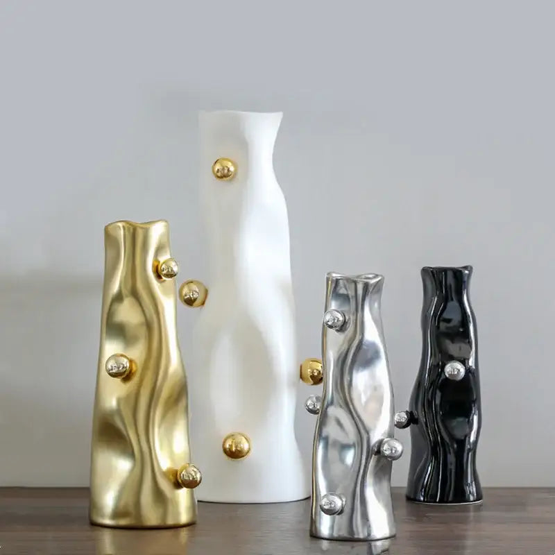 Set of four modern ceramic decorbites geometric sphere vases in gold white silver and black with metallic accents