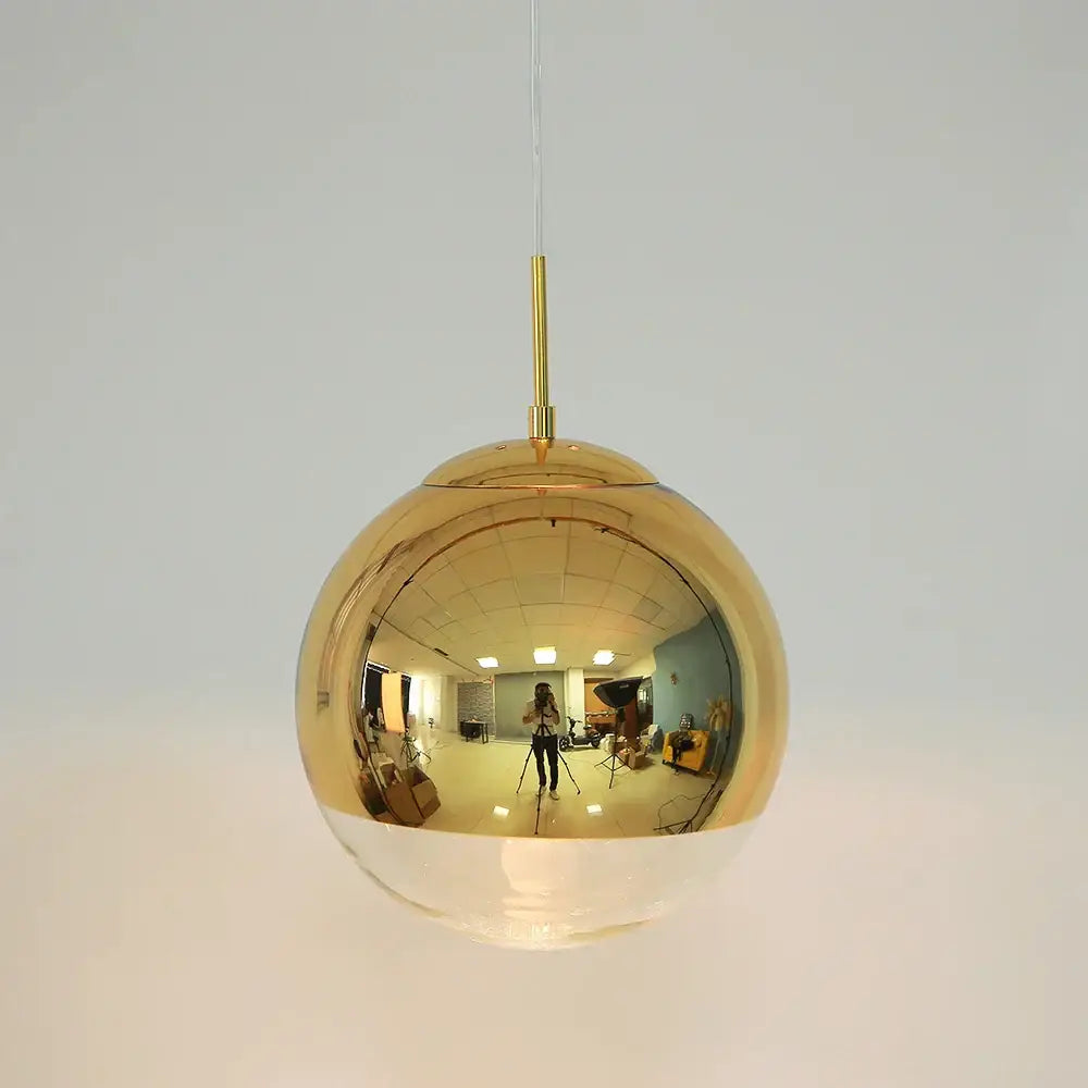 Modern metallic glass ball electroplate pendant light with gold finish brass hardware and reflective globe for kitchen decorbites
