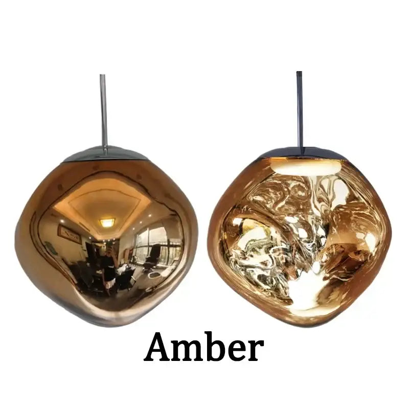 Amber-colored reflective glass pendant lights with a modern organic design for dining room cluster fixture