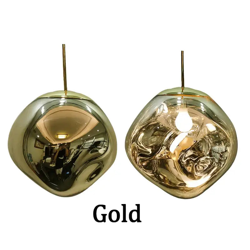 Gold-colored reflective glass pendant lights with smooth rounded shapes for modern dining room cluster fixtures