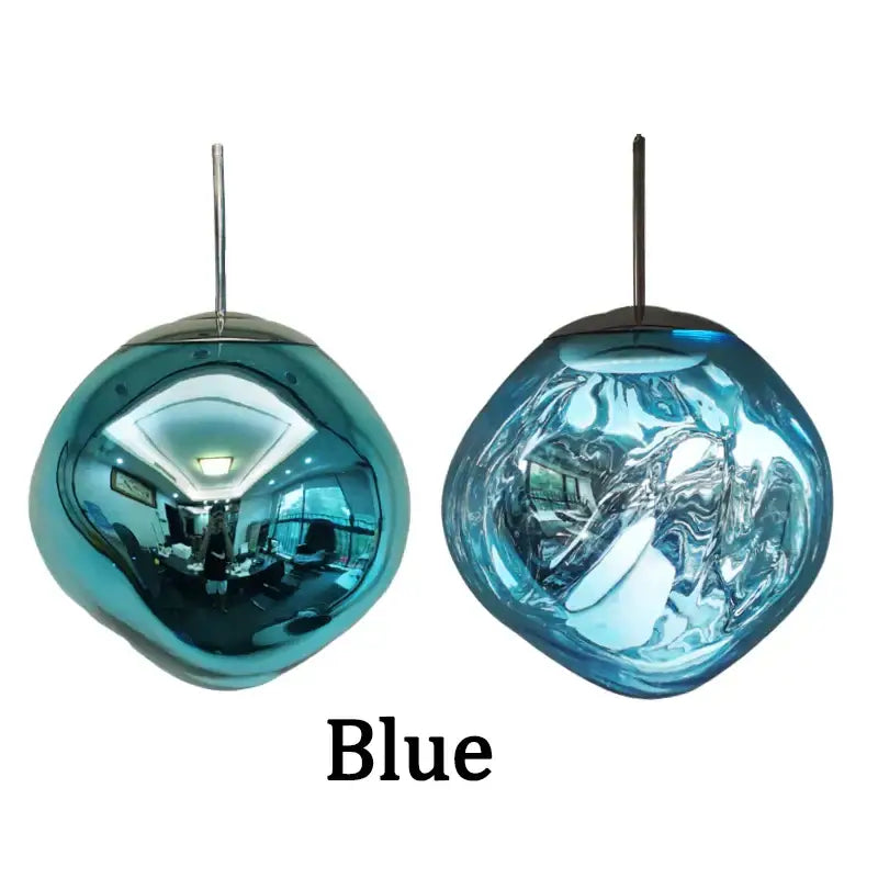 Two modern metallic glass pendant lights with glossy blue teardrop shapes for dining room cluster fixture