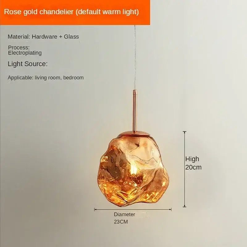 Modern rose gold pendant light with amber-hued decorbites ice glass globe for dining room lighting