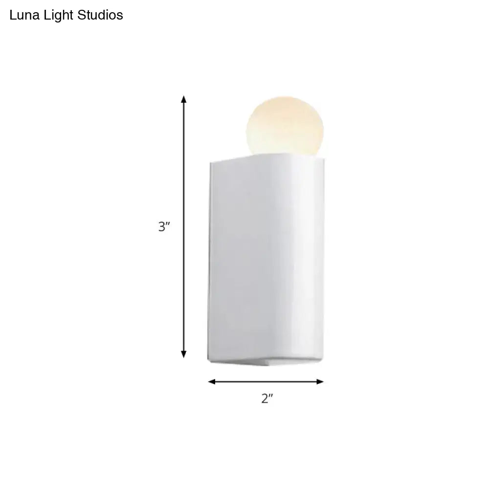 Modern milk glass wall lamp with a white rectangular sconce and small medium glowing ball for bedroom use