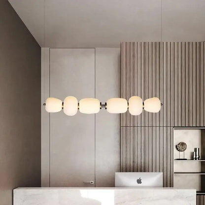 Modern milky white glass ball pendant light with five frosted glass globes and sleek metallic frame for dining room decorbites glass ball pendant