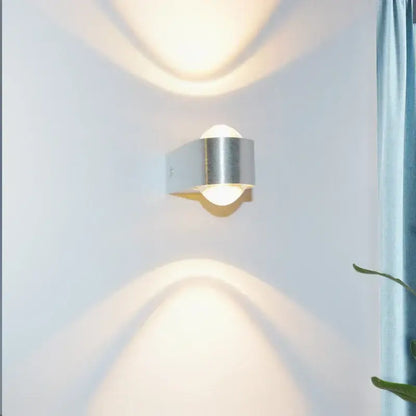 Modern minimalist silver-toned led wall lamp with sleek cylindrical aluminum sconce for bedroom decor lighting