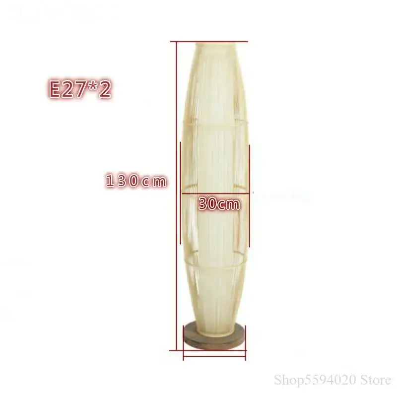 A cream-colored translucent glass floor lamp with vertical ridges featured in decorbites bamboo floor lamp design