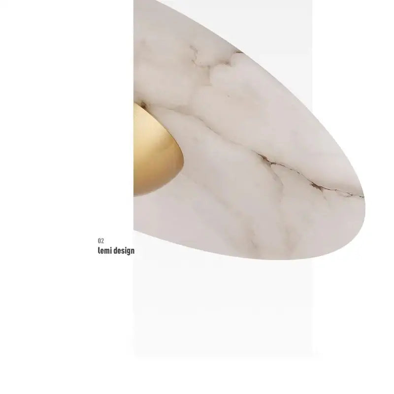 Modern minimalist black cloud stone pendant lamp with white marble surface and gold-toned accent for bedroom decorbites cloud stone