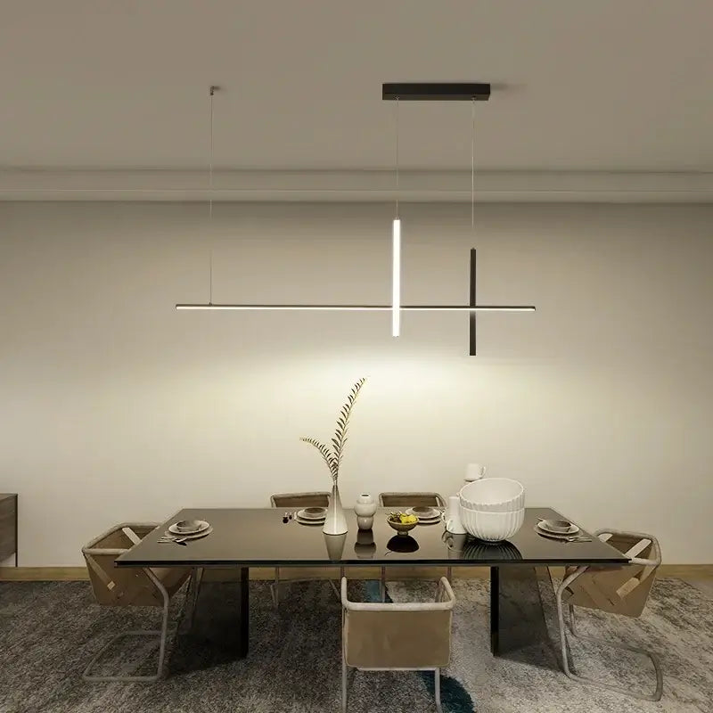 Modern minimalist black and white decorbites dimmable led pendant lights hang above a dining table