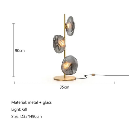 Modern minimalist floor lamp with brass base and three gray glass shade led lights for elegant home decor