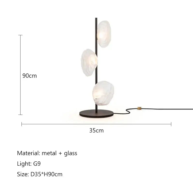 Modern minimalist black floor lamp with three frosted glass shade led bulbs on a sleek metal frame for home decor