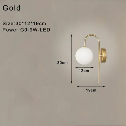 Gold-finished led wall lamp with frosted glass globe and curved arm for modern minimalist bedroom lighting