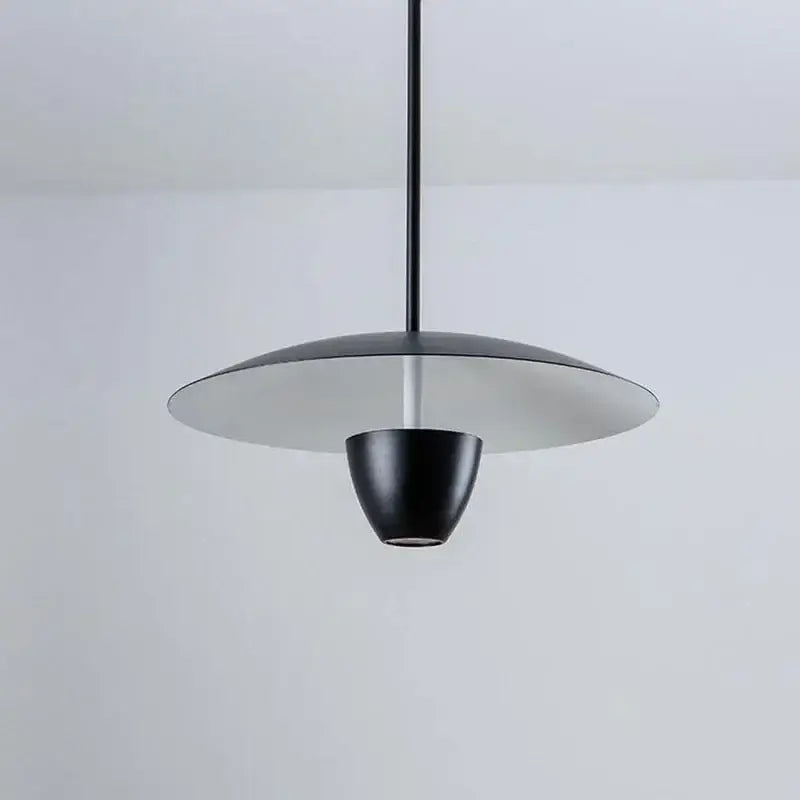 Modern minimalist black led pendant light with sleek disc-shaped shade and conical base for dining room decorbites black led hanging