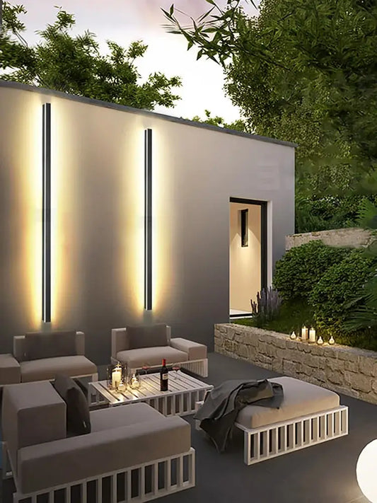 Modern minimalist outdoor lounge set with sleek white metal frames and gray cushions complements decorbites black waterproof wall light