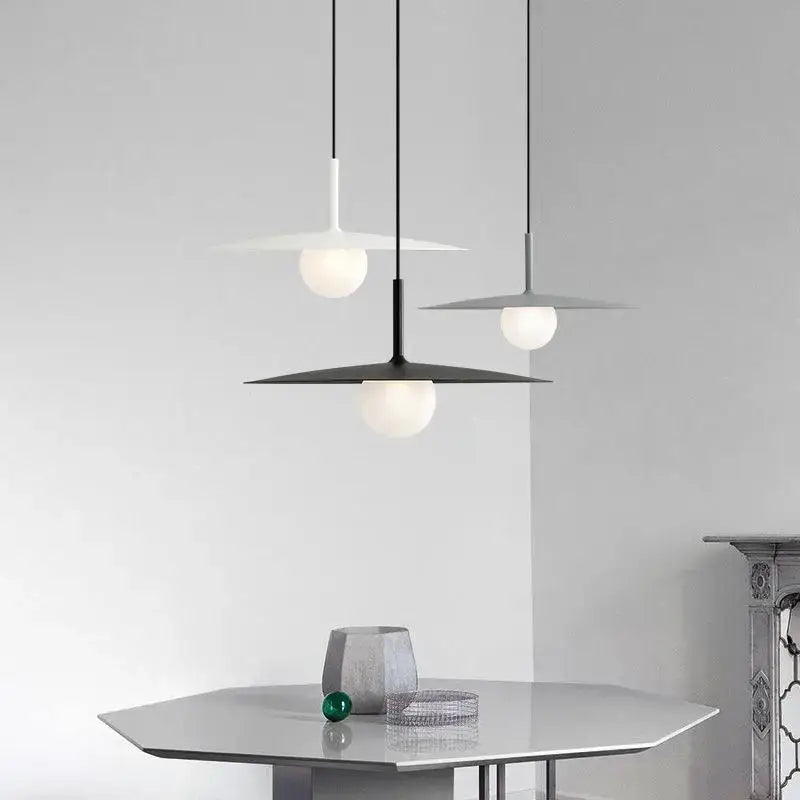 Modern minimalist black and white decorbites flying saucer dining room light with sleek disc-shaped shades and frosted glass globe