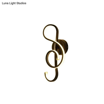 Modern minimalist black and white led ring sconce wall light shaped like a treble clef in dark metallic tone