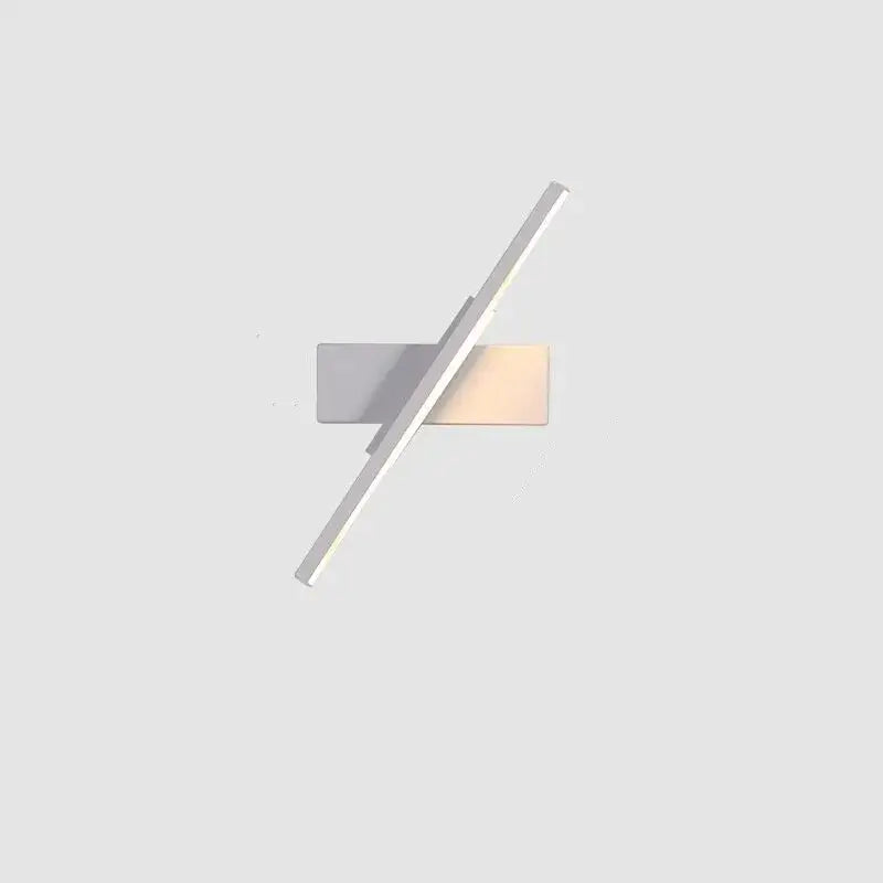 Modern minimalist black and white led wall lamp with sleek silver finish and two intersecting rectangular panels emitting warm light