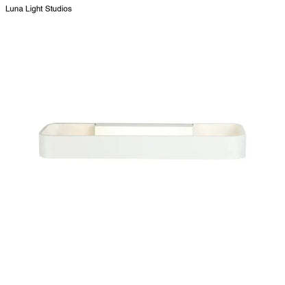 Minimalist white rectangular wall lamp with sleek modern design and smooth matte finish for bedroom lighting