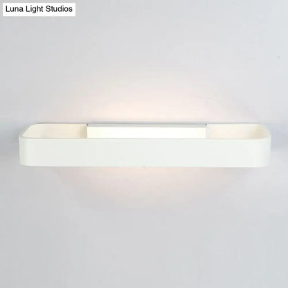 Minimalist white rectangular wall lamp with sleek modern design and soft ambient lighting for bedroom use