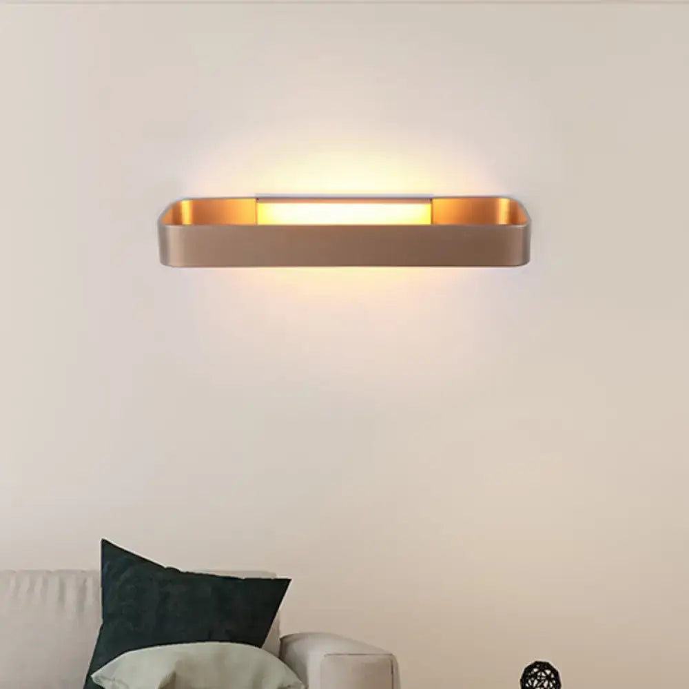 Modern gold-finished rectangular wall lamp with a sleek minimalist design for bedroom lighting