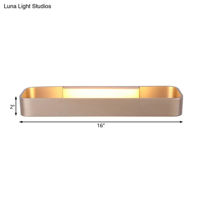 Modern minimalist wall lamp with sleek brushed gold finish and warm evenly distributed light for bedroom use
