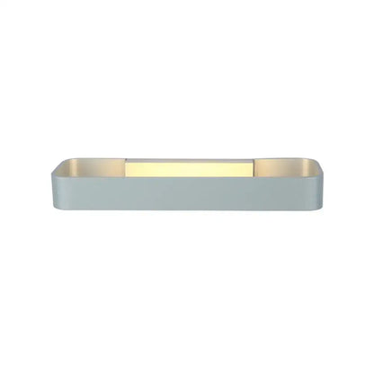 Modern minimalist black and white rectangular wall lamp with matte gray exterior and warm gold interior lighting for bedroom