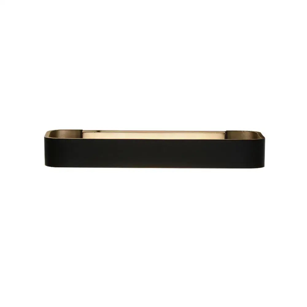 Black rectangular wall lamp with a gold-toned metallic rim and interior for modern minimalist bedroom lighting