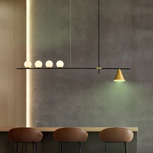 Modern minimalist brass and glass chandelier pendant light with four frosted glass bulbs and conical brass shade