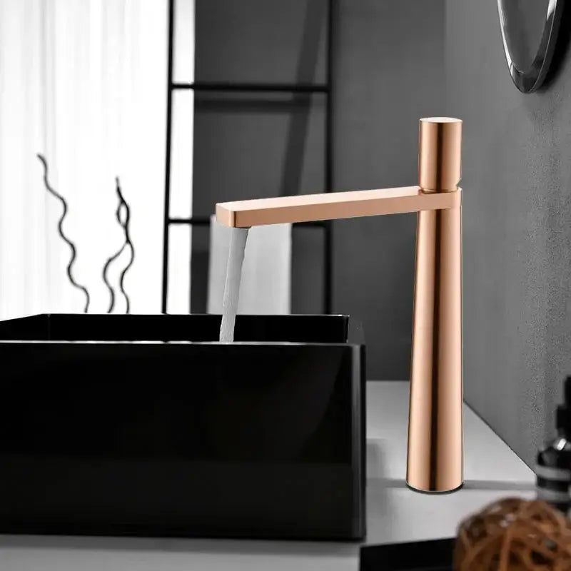 Modern minimalist brushed gold basin faucet with sleek rose gold finish and tall cylindrical spout decorbites brushed gold