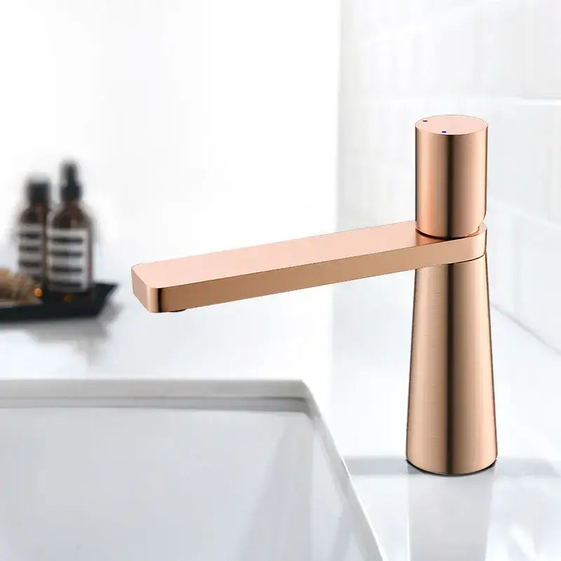 Modern minimalist brushed gold basin faucet with rose gold finish and sleek decorbites brushed gold design