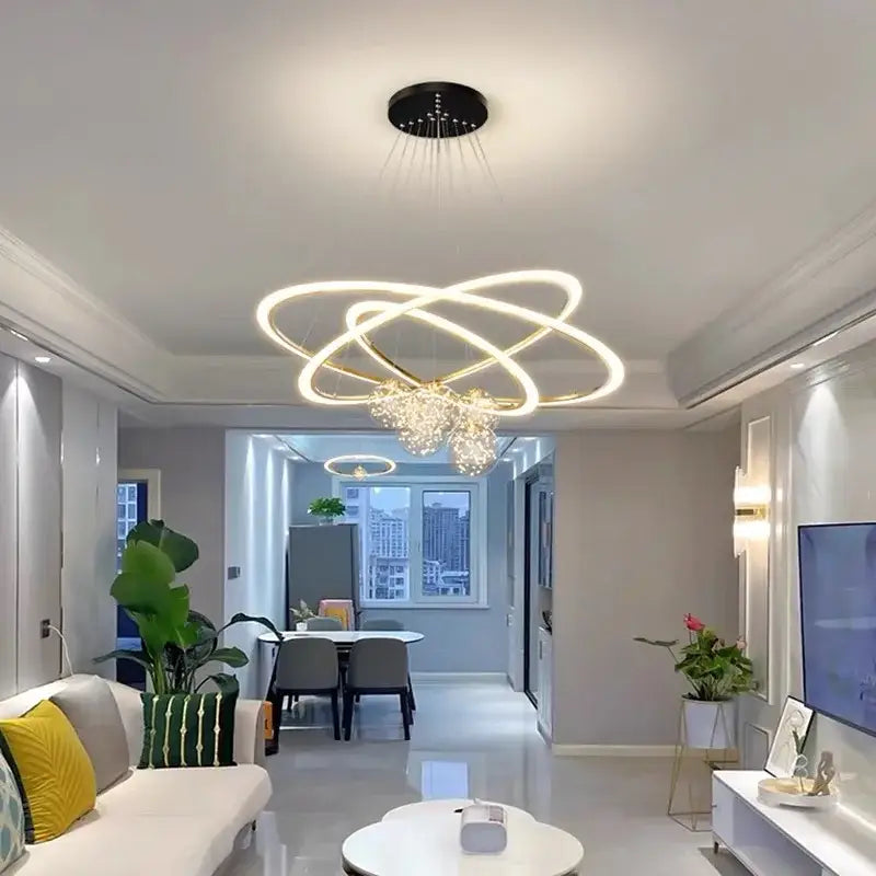 Modern minimalist circle ring pendant chandelier with three glowing decorbites circle rings and crystal for living room decor