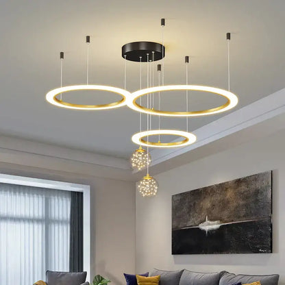Modern gold-toned decorbites circle ring pendant chandelier with crystal globe pendants for living room lighting