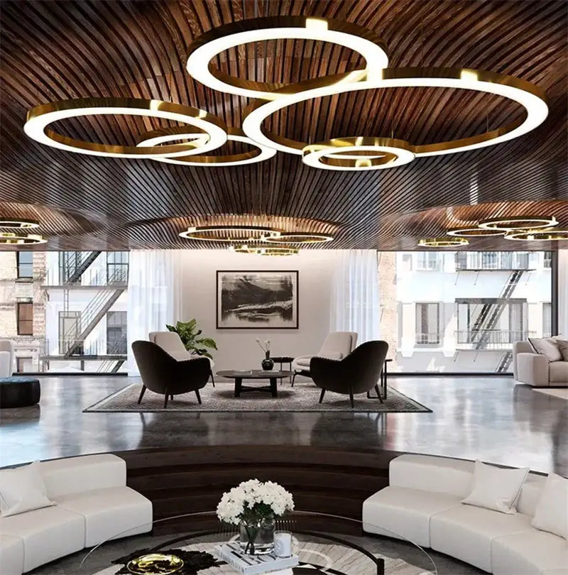Modern minimalist circular gold ring pendant light with concentric LED rings for dining room decorbites circular gold design