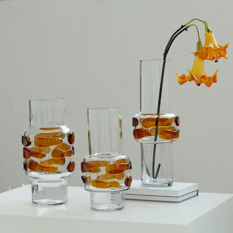 Three clear glass vases with amber embedded pieces and modern minimalist design for decorbites clear glass bubble decor