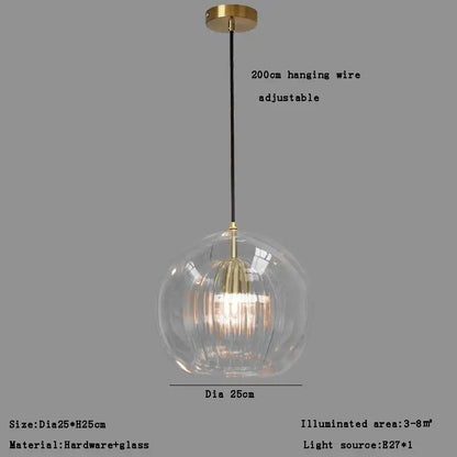 Modern minimalist pendant light with clear glass ball and gold-toned metal fixture for dining room decorbites clear glass