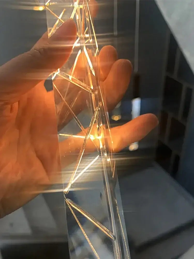 Modern minimalist crystal led pendant light with translucent geometric design and glowing golden lines for living room decorbites crystal led pendant