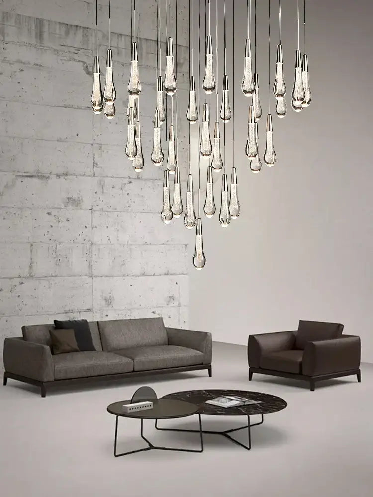 Modern minimalist ceiling chandelier with teardrop-shaped decorbites crystal water-drop glass and sleek metallic finish
