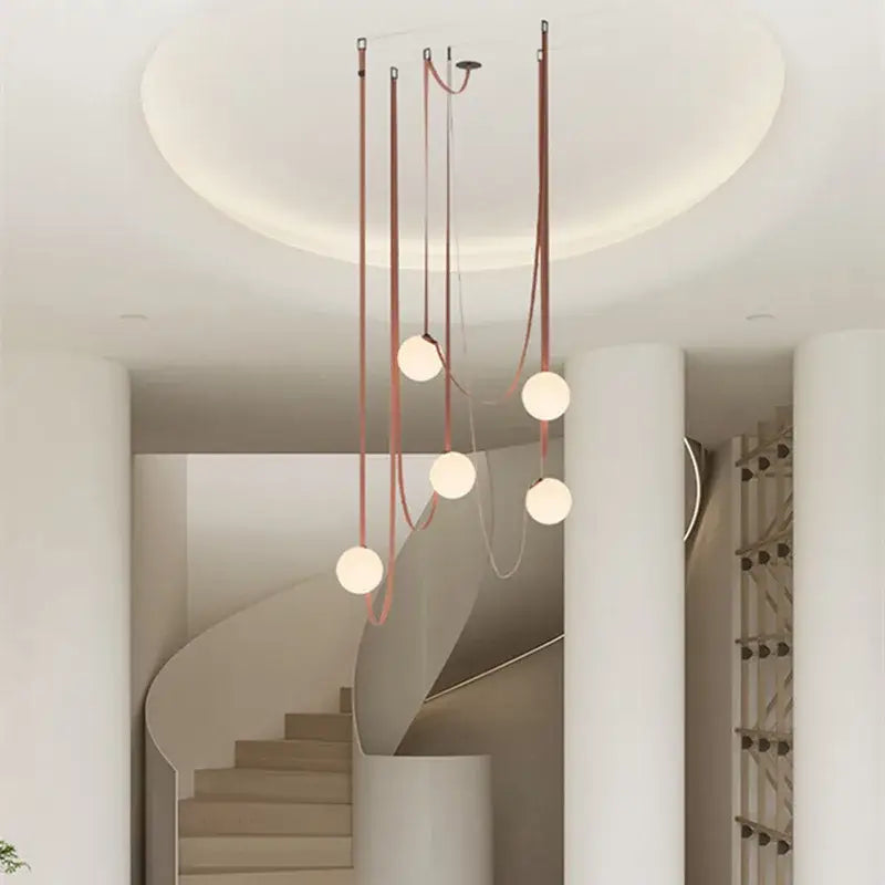 Modern minimalist pendant light with copper-toned fixture and five frosted glass ball bulbs for dining room decorbites glass ball