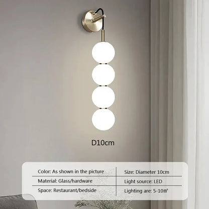Modern minimalist pendant light with four frosted glass ball spheres and brass hardware for living room decorbites glass ball