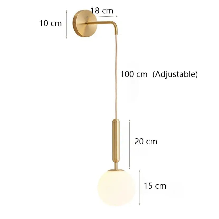 Modern minimalist wall lamp with gold finish, adjustable arm, and spherical frosted glass shade for bedroom lighting